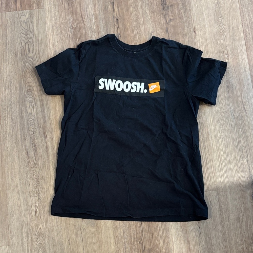Nike Black 'SWOOSH.' Graphic Tee with Orange Accent